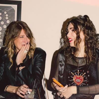 two people talking and laughing