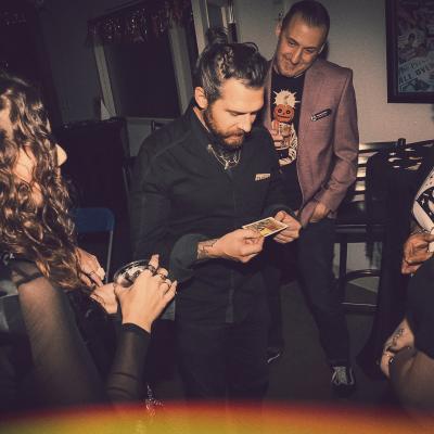 people looking at tarot card