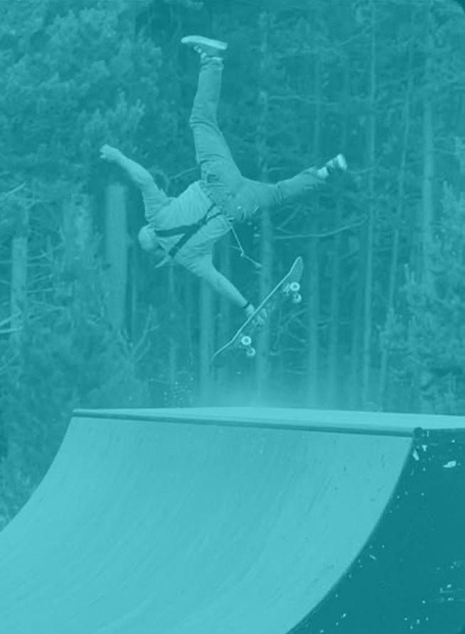 man eating it on skateboard